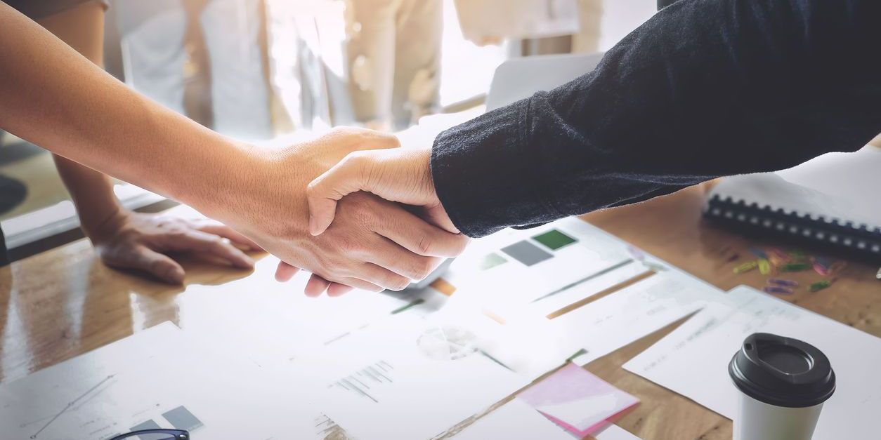 Two business people shaking hands